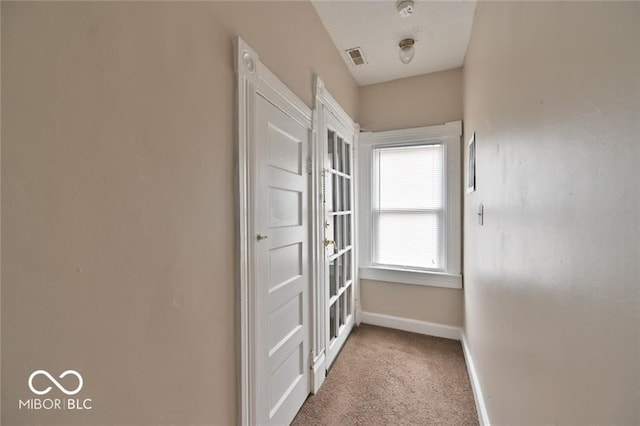 307 N Arlington Ave, Indianapolis, IN 46219 - corridor featuring baseboards and carpet flooring
