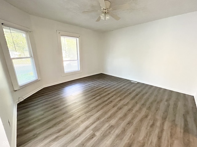 307 N Arlington Ave, Indianapolis, IN 46219 - unfurnished room featuring wood finished floors, ceiling fan, and baseboards