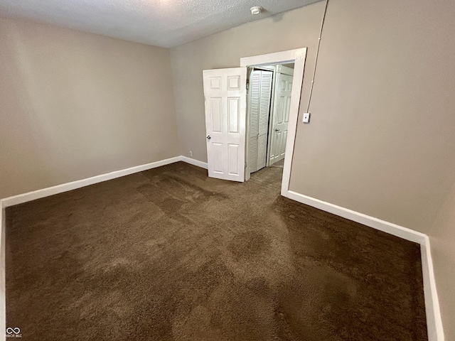 307 N Arlington Ave, Indianapolis, IN 46219 - unfurnished room featuring dark carpet, baseboards, and a smoke detector