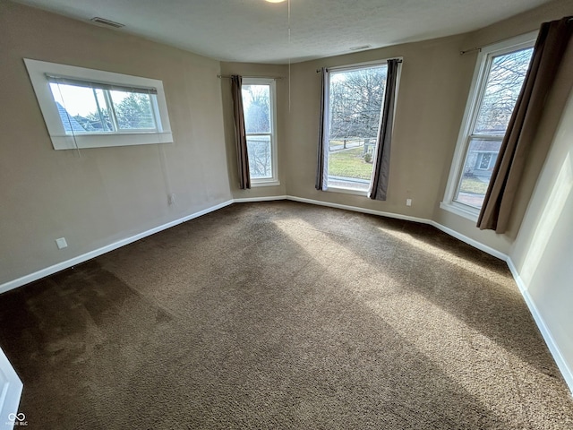 307 N Arlington Ave, Indianapolis, IN 46219 - unfurnished room featuring dark colored carpet and healthy amount of natural light