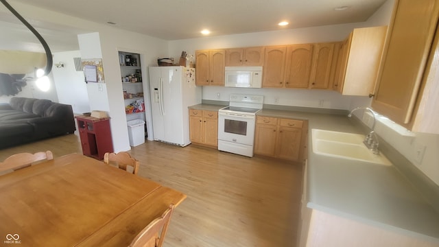 713 Driftwood Cir, Danville, IN 46122 - kitchen featuring white appliances, light brown cabinetry, a sink, light wood finished floors, and recessed lighting