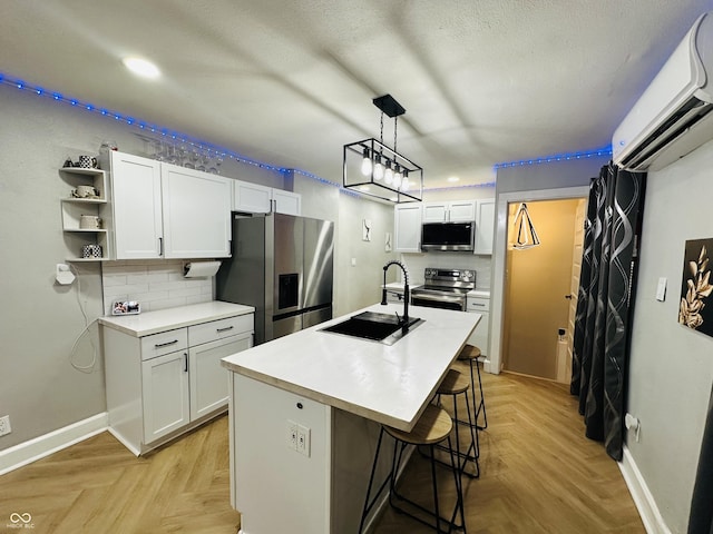 38 Hendricks Pl, Indianapolis, IN 46201 - kitchen with stainless steel appliances, open shelves, white cabinetry, light countertops, and recessed lighting