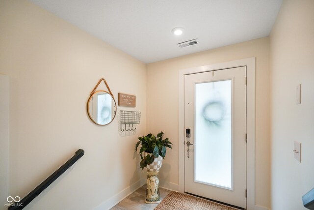 2125 Coretta Way, Indianapolis, IN 46202 - entryway with baseboards and light wood-style flooring