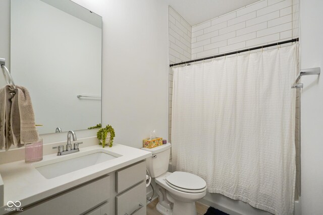 2125 Coretta Way, Indianapolis, IN 46202 - bathroom with toilet, vanity, and shower / bath combo with shower curtain