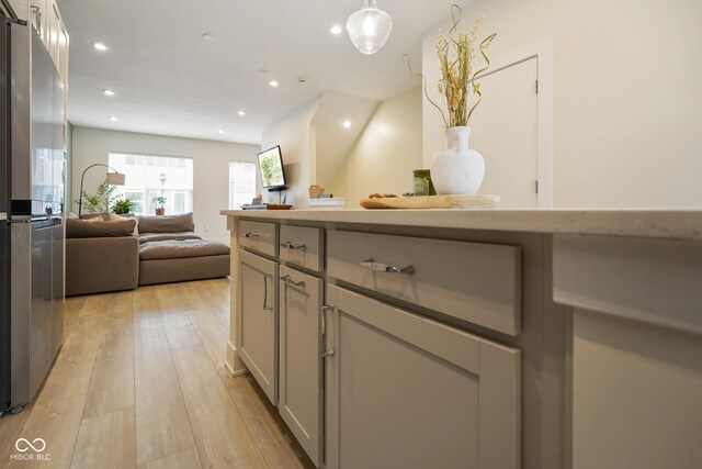 2125 Coretta Way, Indianapolis, IN 46202 - kitchen featuring freestanding refrigerator, open floor plan, gray cabinets, recessed lighting, and light wood-type flooring