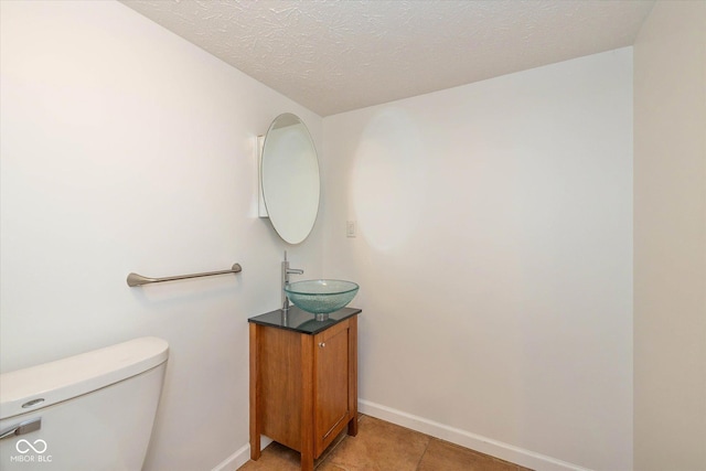 12772 Tram Ln, Carmel, IN 46032 - bathroom featuring vanity and a textured ceiling