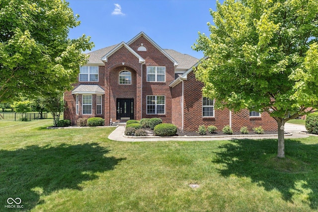12772 Tram Ln, Carmel, IN 46032 - view of front facade with a front lawn and brick siding