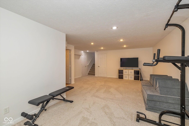 12772 Tram Ln, Carmel, IN 46032 - exercise room with recessed lighting, carpet, and a textured ceiling