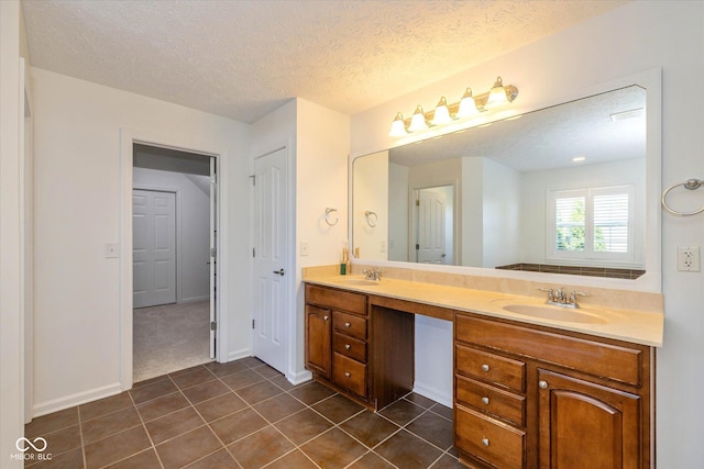 12772 Tram Ln, Carmel, IN 46032 - full bathroom with double vanity, tile patterned floors, and a textured ceiling