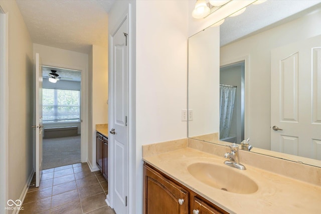 12772 Tram Ln, Carmel, IN 46032 - bathroom with vanity, tile patterned flooring, and a textured ceiling