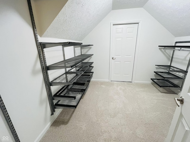 12772 Tram Ln, Carmel, IN 46032 - walk in closet featuring carpet floors and vaulted ceiling