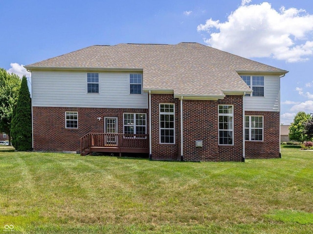 12772 Tram Ln, Carmel, IN 46032 - back of house with brick siding, a deck, a lawn, and a shingled roof