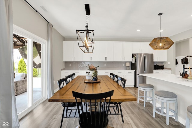 9716 Cimmaron Ave, Mccordsville, IN 46055 - dining area with light wood-style floors and recessed lighting