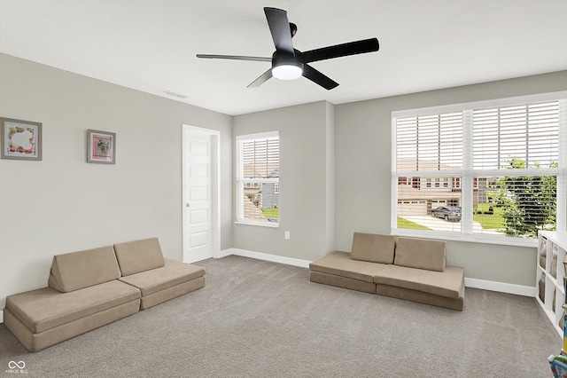 9716 Cimmaron Ave, Mccordsville, IN 46055 - living area featuring baseboards, ceiling fan, and carpet flooring