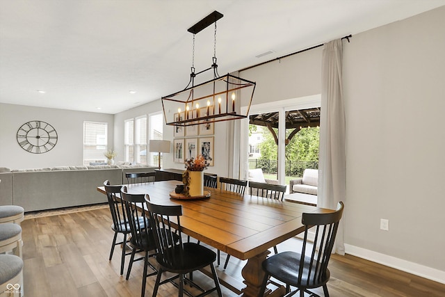 9716 Cimmaron Ave, Mccordsville, IN 46055 - dining room featuring light wood finished floors, recessed lighting, baseboards, and a chandelier