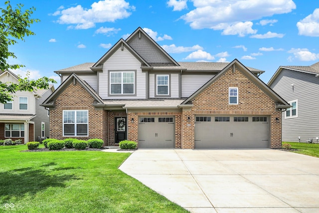 9716 Cimmaron Ave, Mccordsville, IN 46055 - view of front facade featuring driveway, brick siding, a front lawn, and a shingled roof