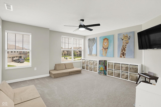 9716 Cimmaron Ave, Mccordsville, IN 46055 - living room featuring carpet floors, a ceiling fan, and baseboards