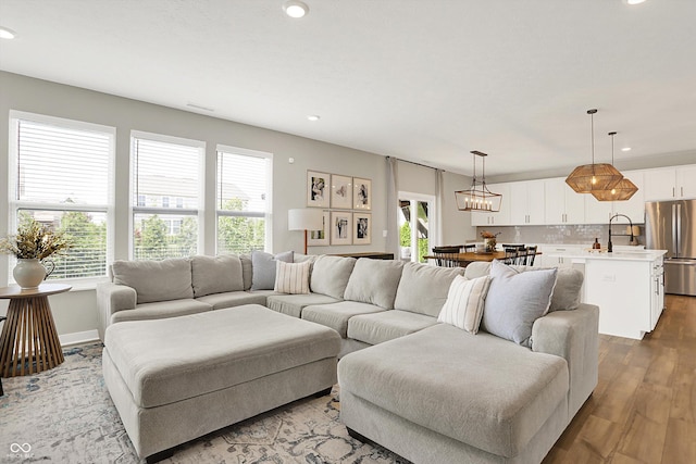 9716 Cimmaron Ave, Mccordsville, IN 46055 - living area with healthy amount of natural light, wood finished floors, recessed lighting, and baseboards