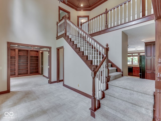 20 Forrests Edge Ct, Indianapolis, IN 46227 - stairs with a towering ceiling, baseboards, and ornamental molding
