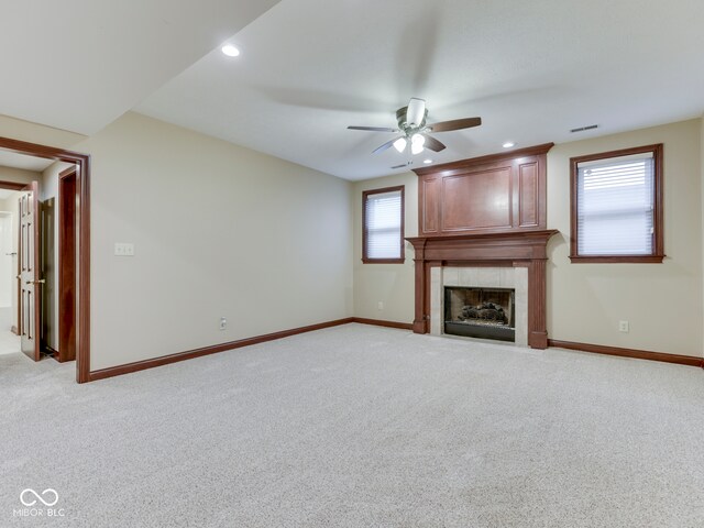 20 Forrests Edge Ct, Indianapolis, IN 46227 - unfurnished living room with a ceiling fan, baseboards, a tile fireplace, light colored carpet, and recessed lighting