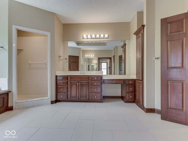 20 Forrests Edge Ct, Indianapolis, IN 46227 - bathroom with vanity, tiled shower, tile patterned flooring, and baseboards