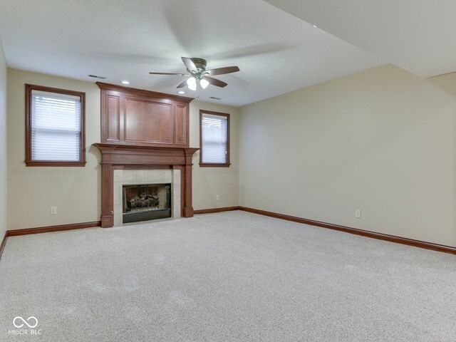 20 Forrests Edge Ct, Indianapolis, IN 46227 - unfurnished living room with ceiling fan, a tiled fireplace, healthy amount of natural light, and baseboards