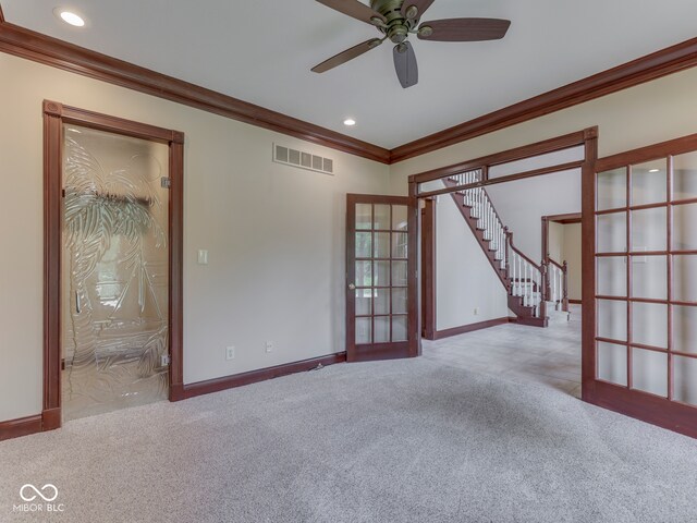 20 Forrests Edge Ct, Indianapolis, IN 46227 - unfurnished room featuring crown molding, carpet flooring, ceiling fan, french doors, and stairs