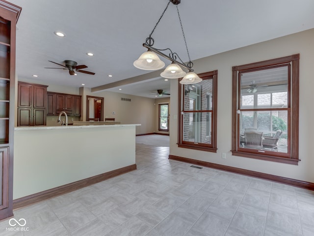 20 Forrests Edge Ct, Indianapolis, IN 46227 - kitchen with ceiling fan, baseboards, recessed lighting, pendant lighting, and light countertops