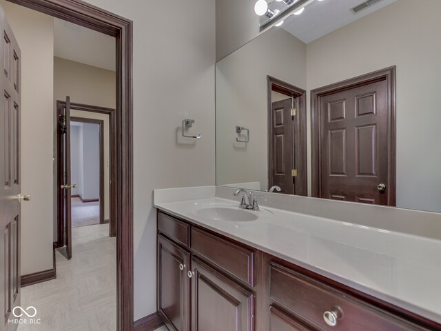 20 Forrests Edge Ct, Indianapolis, IN 46227 - bathroom featuring vanity, tile patterned floors, and baseboards