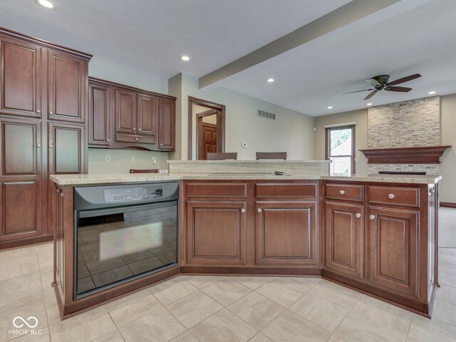 20 Forrests Edge Ct, Indianapolis, IN 46227 - kitchen featuring black oven, ceiling fan, recessed lighting, light tile patterned floors, and light stone countertops