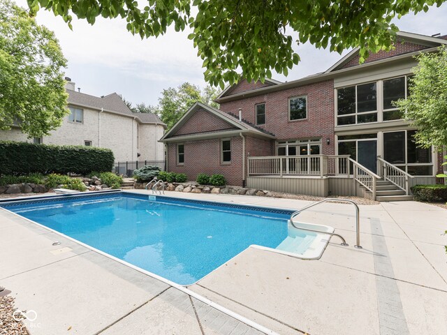 20 Forrests Edge Ct, Indianapolis, IN 46227 - view of swimming pool with a patio and a wooden deck