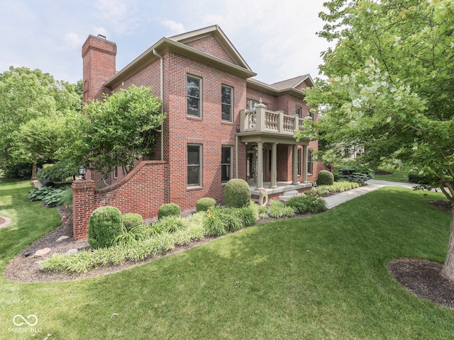 20 Forrests Edge Ct, Indianapolis, IN 46227 - back of property featuring a chimney, brick siding, a yard, and a balcony