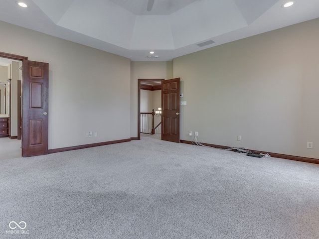 20 Forrests Edge Ct, Indianapolis, IN 46227 - spare room featuring light colored carpet, a raised ceiling, baseboards, recessed lighting, and a ceiling fan