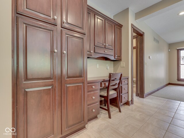 20 Forrests Edge Ct, Indianapolis, IN 46227 - office area with built in desk, light carpet, and baseboards