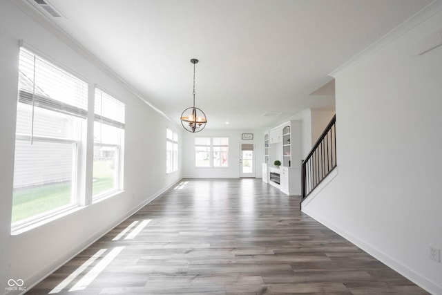 19800 Sutton Ter, Westfield, IN 46074 - unfurnished dining area with a chandelier, baseboards, ornamental molding, wood finished floors, and stairway