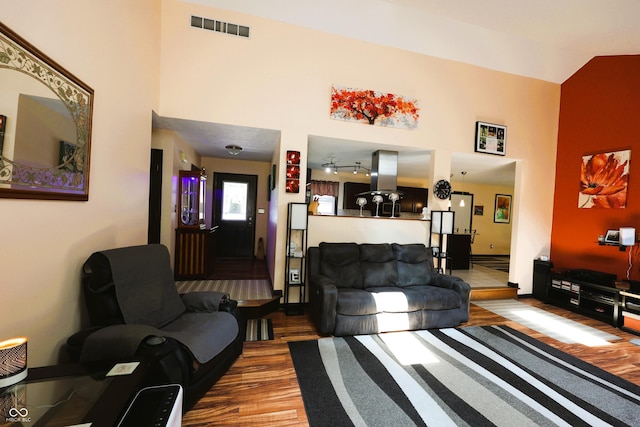 5654 Paradise Dr, Martinsville, IN 46151 - living room featuring wood finished floors, a high ceiling, and baseboards