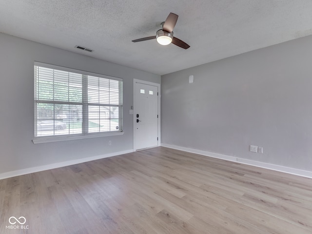 2756 Branigin Creek Blvd, Franklin, IN 46131 - foyer featuring ceiling fan, wood finished floors, baseboards, and a textured ceiling