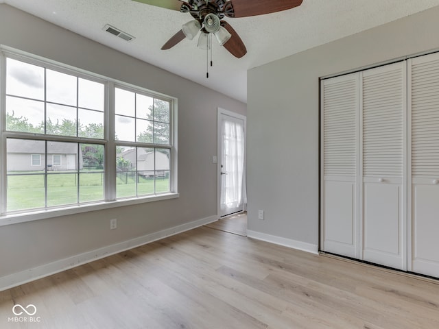 2756 Branigin Creek Blvd, Franklin, IN 46131 - unfurnished bedroom with light wood finished floors, a closet, baseboards, and a ceiling fan