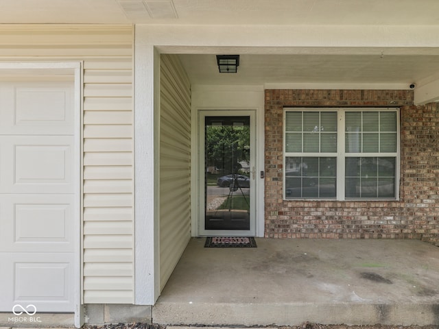 2756 Branigin Creek Blvd, Franklin, IN 46131 - view of exterior entry with brick siding and a garage