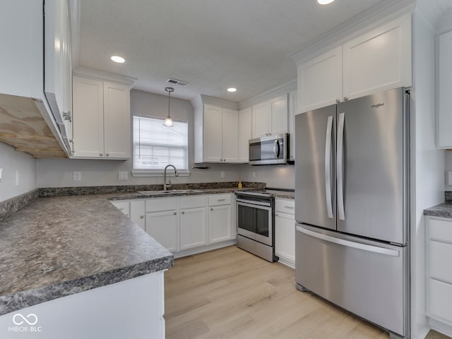 2756 Branigin Creek Blvd, Franklin, IN 46131 - kitchen featuring appliances with stainless steel finishes, a sink, dark countertops, white cabinets, and recessed lighting