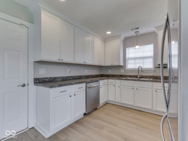2756 Branigin Creek Blvd, Franklin, IN 46131 - kitchen featuring appliances with stainless steel finishes, a sink, light wood-type flooring, white cabinetry, and recessed lighting