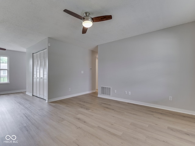 2756 Branigin Creek Blvd, Franklin, IN 46131 - empty room with ceiling fan, light wood-type flooring, baseboards, and a textured ceiling