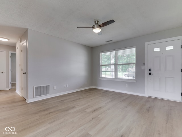 2756 Branigin Creek Blvd, Franklin, IN 46131 - entrance foyer featuring a ceiling fan, light wood-type flooring, baseboards, and a textured ceiling
