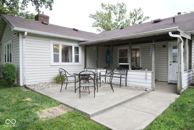 254 Bittersweet Dr, Whiteland, IN 46184 - back of house with a patio area, a chimney, and roof with shingles