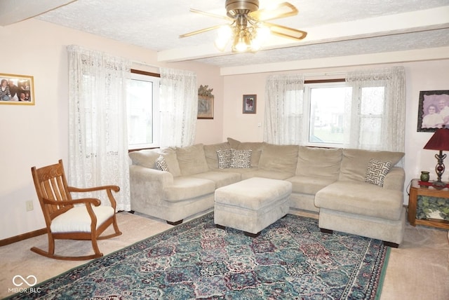 254 Bittersweet Dr, Whiteland, IN 46184 - carpeted living room featuring plenty of natural light, ceiling fan, baseboards, and a textured ceiling