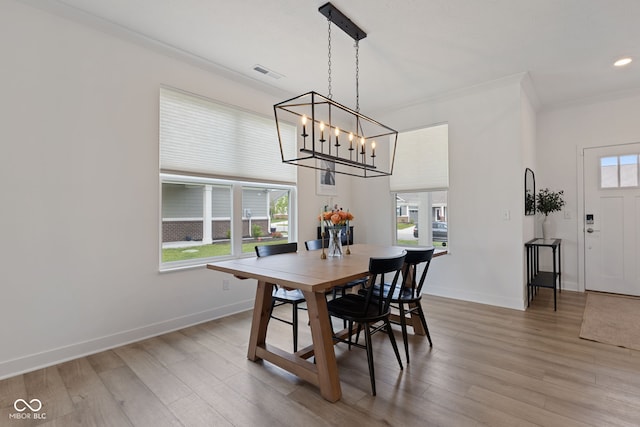 14848 Stonneger St, Westfield, IN 46074 - dining space with a chandelier, ornamental molding, light wood-type flooring, baseboards, and recessed lighting