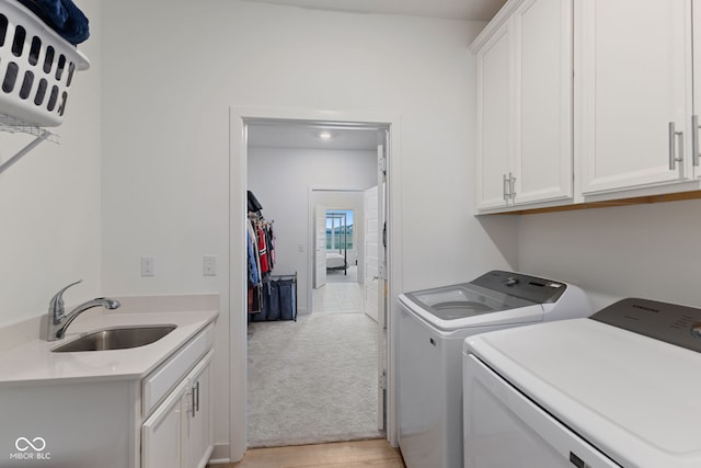 14848 Stonneger St, Westfield, IN 46074 - laundry area featuring separate washer and dryer, cabinet space, and light colored carpet