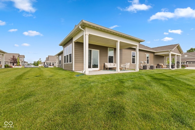 14848 Stonneger St, Westfield, IN 46074 - rear view of house with outdoor lounge area, a patio, a yard, and central air condition unit