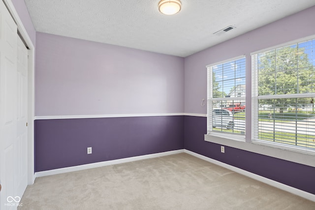 10693 Newgate Ln, Indianapolis, IN 46231 - carpeted empty room featuring a textured ceiling and baseboards