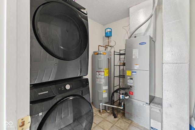 10693 Newgate Ln, Indianapolis, IN 46231 - laundry area featuring electric water heater, stacked washer / drying machine, and a textured ceiling